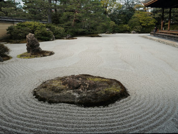 Traditional zen rock garden with carefully raked gravel patterns Photo by fan yang on Unsplash Traditional zen rock garden with carefully raked gravel patterns Photo by fan yang on Unsplash