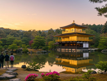 Guests walking toward the Golden Pavilion in soft morning light Guests walking toward the Golden Pavilion in soft morning light