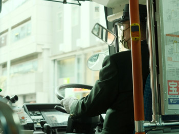 A Kyoto city bus navigating through tree-lined streets with passengers looking out windows Photo by Hendrik Schuette on Unsplash A Kyoto city bus navigating through tree-lined streets with passengers looking out windows Photo by Hendrik Schuette on Unsplash