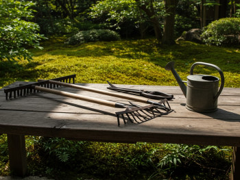 Garden tools arranged on wooden platform. Garden tools arranged on wooden platform.