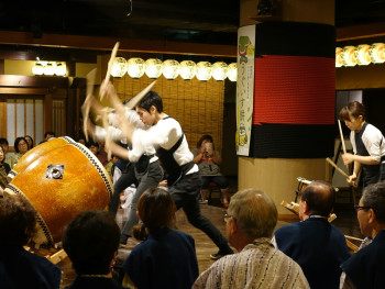 Traditional performing arts taking place in a contemporary Kyoto venue with audience engagement Photo by Arthur Tseng on Unsplash