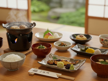 A traditional Japanese meal setup showing proper bowl positioning and serving etiquette A traditional Japanese meal setup showing proper bowl positioning and serving etiquette
