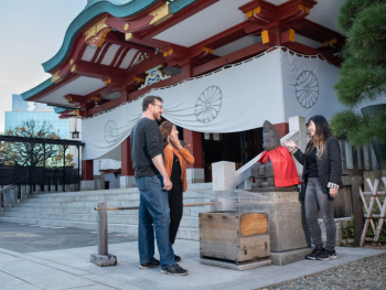 Local host explaining temple history to guest. Local host explaining temple history to guest.