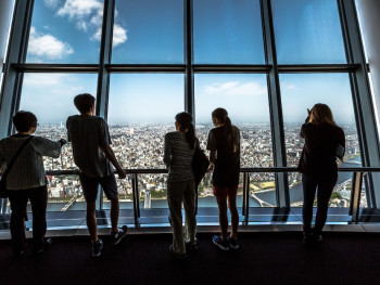 Interior view of Tokyo Skytree with visitors looking out over city. Photo by Kazuo ota on Unsplash Interior view of Tokyo Skytree with visitors looking out over city. Photo by Kazuo ota on Unsplash
