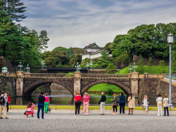 People admiring the Imperial Palace in Tokyo People admiring the Imperial Palace in Tokyo