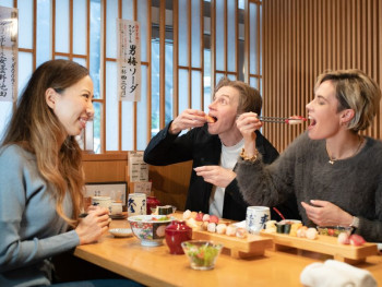 Guests eating fresh sushi Guests eating fresh sushi