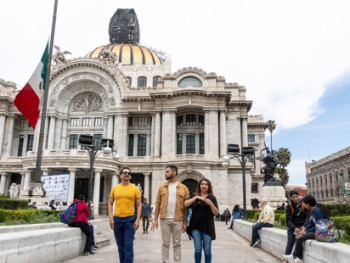 City Unscripted host and guests walking in front of Palacio de Bellas Artes City Unscripted host and guests walking in front of Palacio de Bellas Artes