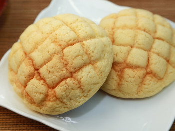 Fresh melon pan bread with distinctive cross-hatch pattern on top Fresh melon pan bread with distinctive cross-hatch pattern on top