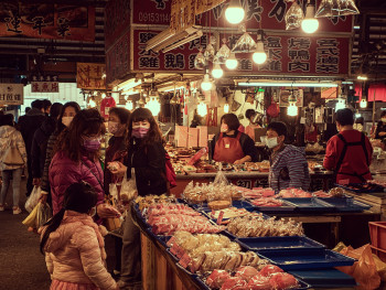 Traveler sampling Japanese sweets in Nishiki Market Photo by Charles Chen on Unsplash Traveler sampling Japanese sweets in Nishiki Market Photo by Charles Chen on Unsplash