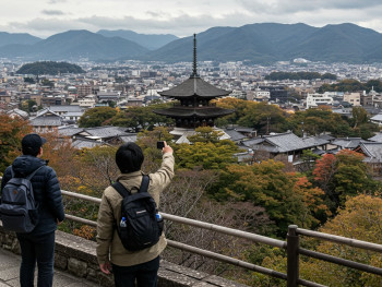 A guide and visitor standing at a scenic overlook of Kyoto city with temples and traditional rooftops spread below, both looking out at the view with a sense of anticipation and discovery A guide and visitor standing at a scenic overlook of Kyoto city with temples and traditional rooftops spread below, both looking out at the view with a sense of anticipation and discovery