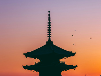 A traveler watching the sunset over Kyoto from a quiet hillside viewpoint, with temple rooftops silhouetted against the evening sky Photo by Ash Edmonds on Unsplash A traveler watching the sunset over Kyoto from a quiet hillside viewpoint, with temple rooftops silhouetted against the evening sky Photo by Ash Edmonds on Unsplash