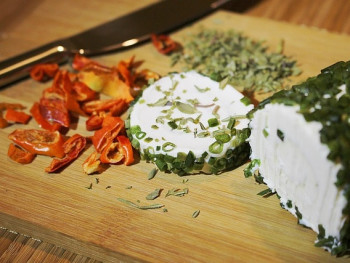 Goat's cheese on wooden surface Goat's cheese on wooden surface