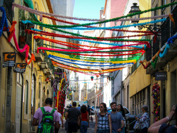 Daytime view of Bairro Alto’s narrow streets with traditional shops 