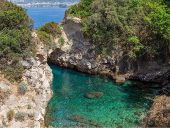 Secluded rocky cove with clear water and Roman ruins on Sorrento coast Secluded rocky cove with clear water and Roman ruins on Sorrento coast