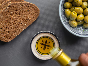 Olive oil tasting with a small bowl and bread Olive oil tasting with a small bowl and bread