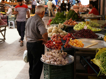 Morning market on Corso Italia with fresh lemons and other produce Morning market on Corso Italia with fresh lemons and other produce