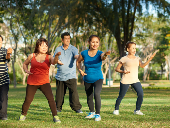 People practicing tai chi at an outdoor square