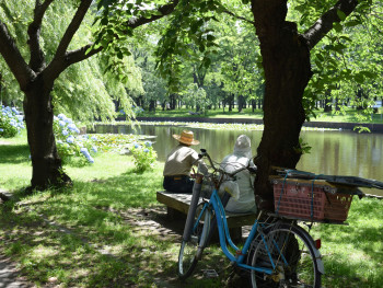 Local residents picnicking in quiet corner of a park Local residents picnicking in quiet corner of a park