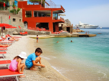 Children playing at the beach at Marina Piccola Children playing at the beach at Marina Piccola
