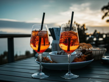 Classic Milanese bar with cocktails and aperitivo snacks at sunset Classic Milanese bar with cocktails and aperitivo snacks at sunset