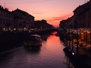 Sunset over Milan canals with reflections on the water Sunset over Milan canals with reflections on the water