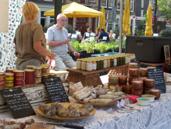 Vibrant street scene in Amsterdam with local food stalls Vibrant street scene in Amsterdam with local food stalls