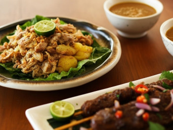 Plate of Surinamese roti with curry potatoes, green beans, and tender chicken Plate of Surinamese roti with curry potatoes, green beans, and tender chicken