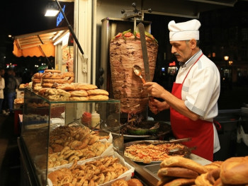 Late-night food scene in Amsterdam with Turkish bakery, döner spits, and food stalls Late-night food scene in Amsterdam with Turkish bakery, döner spits, and food stalls