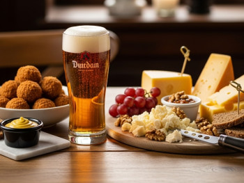 Dutch beer served with bitterballen and a cheese plate Dutch beer served with bitterballen and a cheese plate