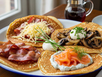 Traditional Dutch pancakes served with savory toppings Traditional Dutch pancakes served with savory toppings