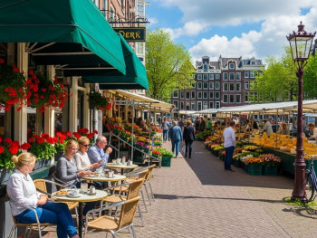 Local Amsterdam café with outdoor seating and a bustling market in the background Local Amsterdam café with outdoor seating and a bustling market in the background