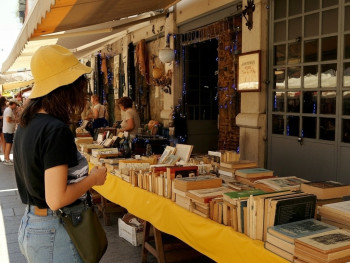 Stalls at Feira da Ladra, displaying vintage items and antiques in the market Stalls at Feira da Ladra, displaying vintage items and antiques in the market