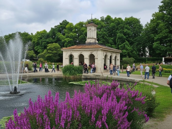 Botanical gardens at the Gulbenkian Museum, with lush greenery and a peaceful lake Botanical gardens at the Gulbenkian Museum, with lush greenery and a peaceful lake