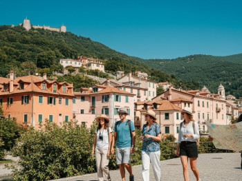 Scenic view of Sintra’s palaces and lush gardens, with mountains in the background Scenic view of Sintra’s palaces and lush gardens, with mountains in the background