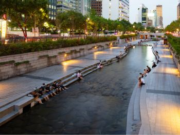 People relaxing by Cheonggyecheon Stream People relaxing by Cheonggyecheon Stream