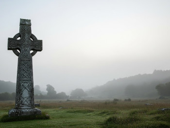 Ancient high crosses and quiet morning mist in Boyne Valley near Monasterboice Ancient high crosses and quiet morning mist in Boyne Valley near Monasterboice