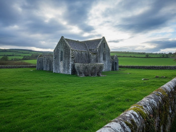 Quiet Mellifont Abbey with the octagonal lavabo and peaceful fields Quiet Mellifont Abbey with the octagonal lavabo and peaceful fields