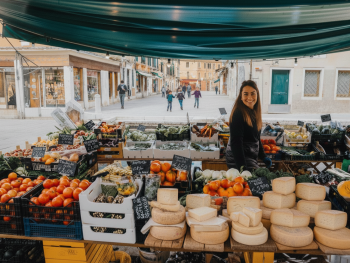 Bracciano market stall stacked with greens and cheese Bracciano market stall stacked with greens and cheese