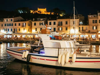 Night walk to Marina Grande with grilled fish scents and locals dining by boats Night walk to Marina Grande with grilled fish scents and locals dining by boats
