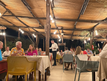 Garden terrace at Da Filippo Restaurant with rustic decor and warm evening light Garden terrace at Da Filippo Restaurant with rustic decor and warm evening light