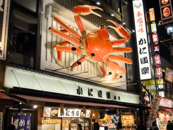 Mechanical crab sign lighting up Dotonbori at night Mechanical crab sign lighting up Dotonbori at night