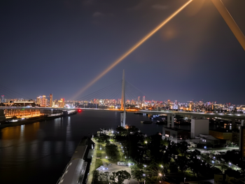 View from the ferris wheel gondola showing the Osaka city lights below View from the ferris wheel gondola showing the Osaka city lights below