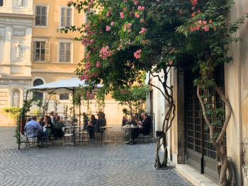 Piazza Madonna dei Monti with locals and a corner café Piazza Madonna dei Monti with locals and a corner café