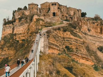 The footbridge to Civita di Bagnoregio over a deep gorge The footbridge to Civita di Bagnoregio over a deep gorge