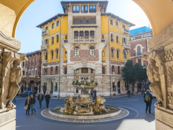 A wide street view showing Gino Coppedè’s ornate  facades and arches around Piazza Mincio A wide street view showing Gino Coppedè’s ornate  facades and arches around Piazza Mincio