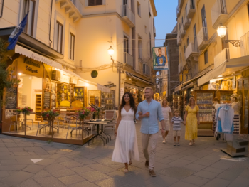 Evening stroll along San Cesareo with lit shopfronts Evening stroll along San Cesareo with lit shopfronts