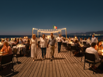 Candlelit deck at Leonelli’s with diners and soft waves Candlelit deck at Leonelli’s with diners and soft waves