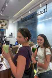 Tourists sipping matcha delights in Hong Kong.