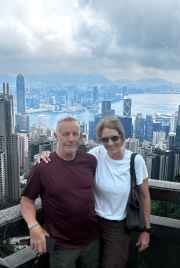 A couple enjoys a breathtaking view over Hong Kong's skyline.