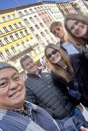 A joyous group captured against the colorful facades of Munich.